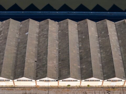 Aerial view of the sawtooth roof of a warehouse in Parque das Nacoes, Lisbon, Lisbon, Portugal.