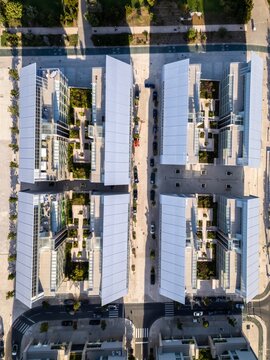 Aerial view of the modern Braco de Prata residential complex featuring geometric buildings with internal courtyards and lush greenery in Lisboa, Lisboa, Portugal.