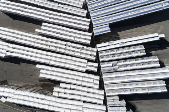 Aerial view of stacked white rectangular construction materials arranged in neat rows at the Kallered industrial site in Molndal, Vastra Gotaland, Sweden.