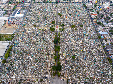 Aerial view of Maximo Gomez National Cemetery with its dense grid of graves, pathways, and surrounding urban landscape in Santo Domingo, Distrito Nacional, Dominican Republic.