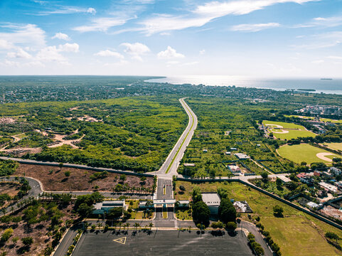 Aerial view of the Base de Infanteria de Marina Valm Manuel Ramon Montes Arache with green vegetation, a road, and baseball fields in Boca Chica, Santo Domingo, Dominican Republic.