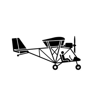 A silhouette of an ultralight aircraft with a pilot in the cockpit, ready for flight