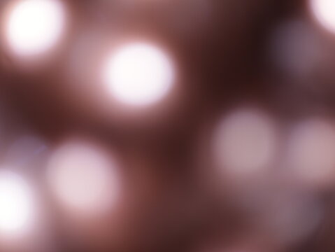 Una toma de cerca de una fondo abstracto de luces de navidad de color marr&oacute;n y blanco en la oscuridad. Desenfoque bokeh

