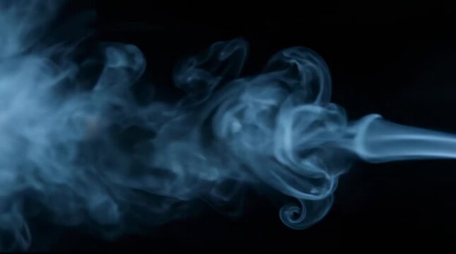 White smoke billowing against black background