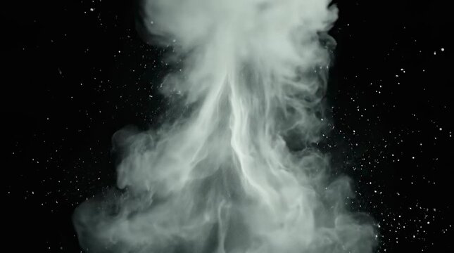 White powder explosion erupting against black background
