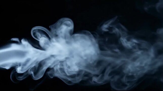 White smoke plume expanding against black background