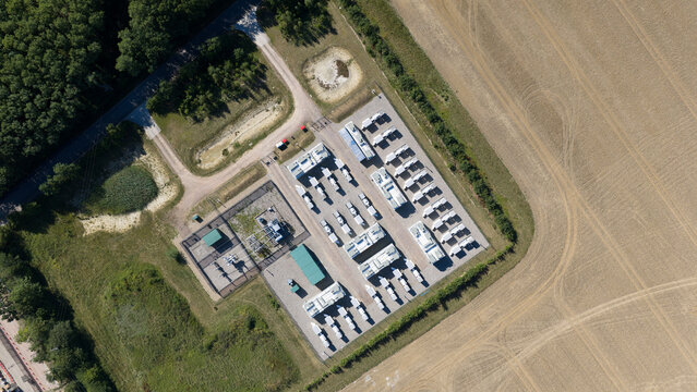 Aerial view of Pelham Storage Limited featuring rows of storage units and containers situated within a rural landscape near fields and woodland in Bishop's Stortford, England, United Kingdom.