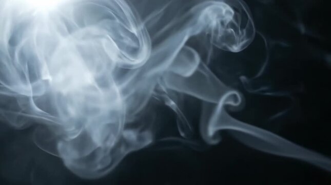 Abstract white smoke swirling against dark background