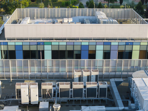 Aerial view of ai data center cooling system with rows of industrial HVAC units on a modern building rooftop in Krakow, Lesser Poland Voivode, Poland.
