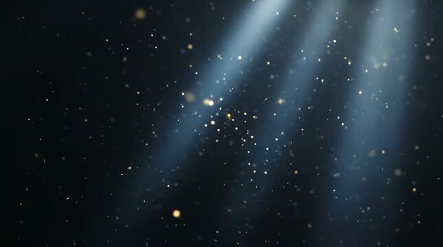 Golden particles floating in blue light beams