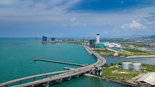 Cebu City, Philippines - 19 July 2026: Aerial view of the Cebu-Cordova Link Expressway stretching over the Mactan Channel, with modern coastal developments and the city skyline in the background.