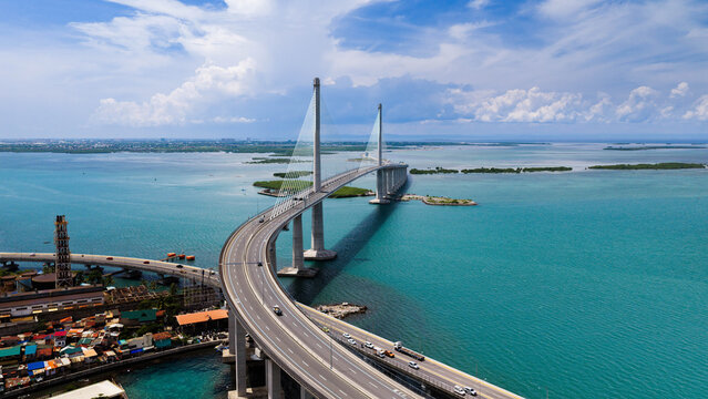 Cebu City, Philippines - 19 July 2026: Aerial view of the Cebu-Cordova Link Expressway spanning the turquoise waters with modern cable-stayed architecture and coastal landscape.