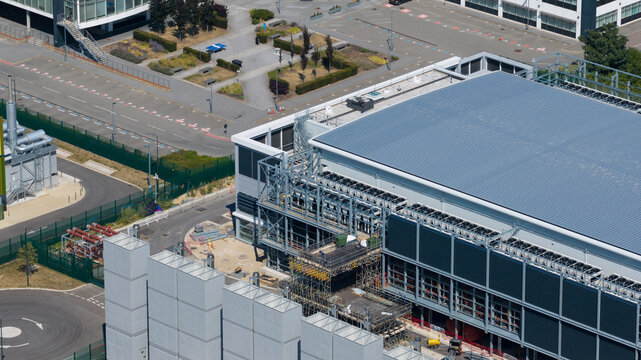 Aerial view of the Kao Data facility featuring modern industrial architecture with rooftop cooling units and surrounding infrastructure in Harlow, England, United Kingdom.