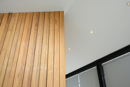 modern architecture background with black steel frame and wooden slat wall