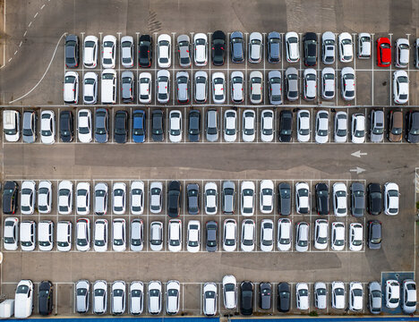 Aerial view of a car lot filled with numerous parked vehicles arranged in neat rows in Ramat Hasharon, Tel Aviv District, Israel.