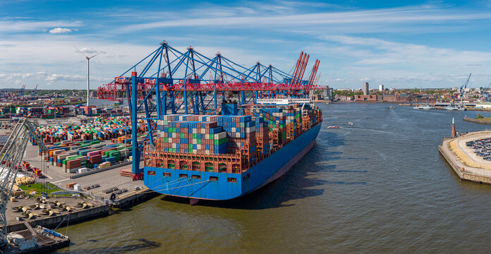 Aerial view of HHLA Container Terminal Tollerort in the Port of Hamburg with a large container ship, colorful shipping containers, and cranes in Hamburg, Hamburg, Germany.