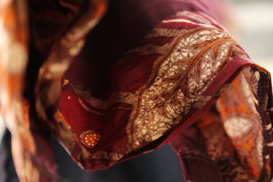 Traditional Ethnic Batik Fabric Texture Background Red Gold Silk