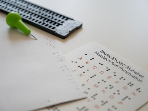 A set for writing in Braille on paper.