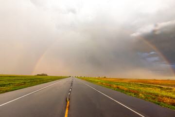 Obraz premium Rainbow After the Storm. Climate Change, Extreme Weather, Supercell Storms, Environmental Sustainability and Hope for a Changing Planet