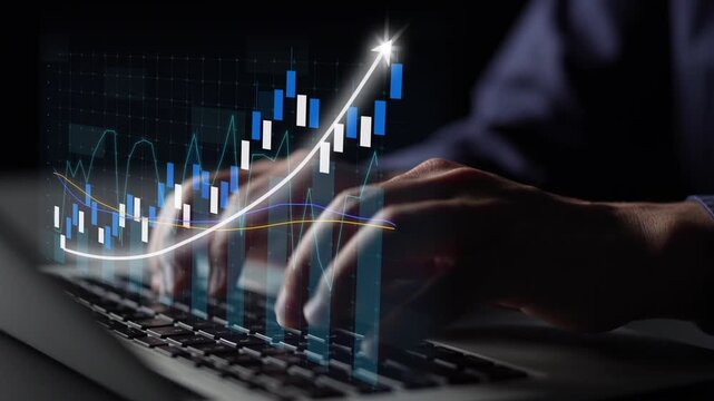 Close-up of hands typing on a keyboard with a digital graph overlay showing upward trends, symbolizing business growth and the influence of technology in data analysis. Copula