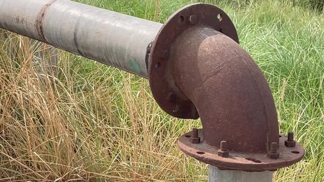 Old Rusty Metal Tubewell Pipe and Flange Connection Outdoors