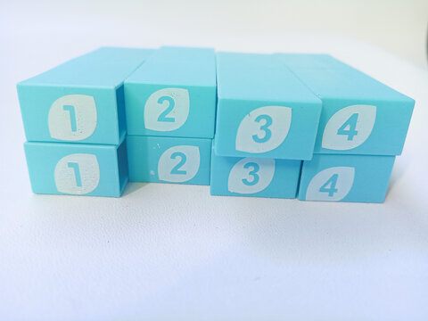 Light blue plastic numbered blocks on white background