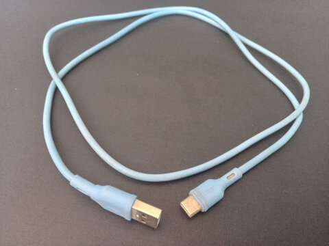 Light blue USB Type C cable on dark background