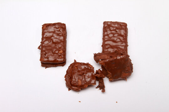 chocolate bar with hazelnuts on table