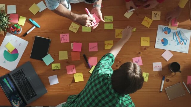 Top view of project manager working while marketing team support her performance. Caucasian businesswoman working together with group of smart people choose idea at meeting. Time lapse. Convocation.