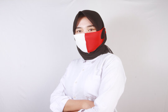 young woman with red and white mask