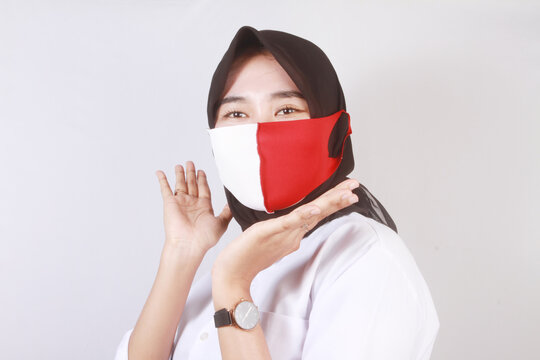 young woman in a white mask