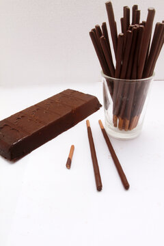 chocolate bar and chocolate sticks on table