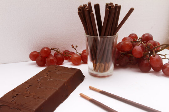 chocolate bar with chocolate stick on table