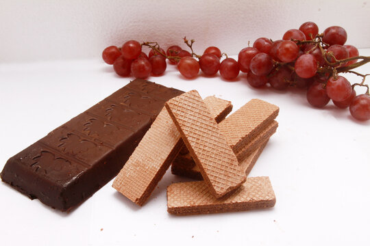chocolate bar with waffle biscuits on table