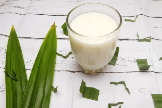 glass of milk on white table
