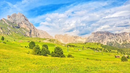 Obraz premium Panoramic View of Seceda Alpine Meadows and Dolomite Peaks, South Tyrol, Italy