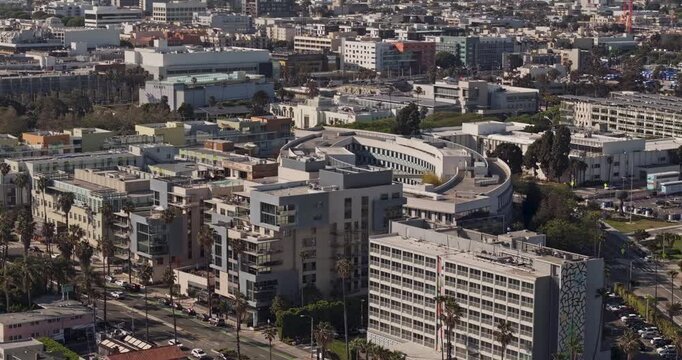 Santa Monica California Aerial v8 telephoto birds-eye flyover above Ocean Park, revealing downtown city blocks, beach corridor and mountain backdrop - Shot with Mavic 3 Pro Cine - May 25th 2024