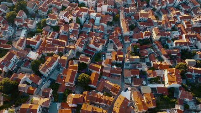 Top-down drone view of Split Old Town rooftops at sunrise revealing the historic city, Croatia, Part 1