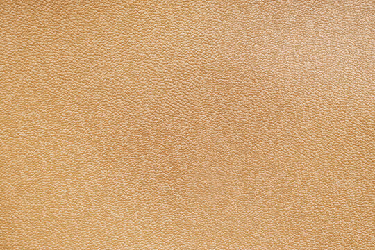 Light brown leather texture background with natural grain pattern, full frame surface for design and material concepts