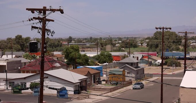 Afternoon hot summer view of buildings and surrounding mountains of Needles, California, USA.