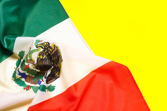 Mexican flag on yellow background, closeup