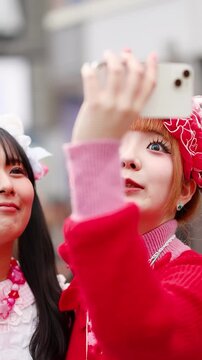 Japanese Gen Z Women in Decora Fashion Taking Selfie in Harajuku