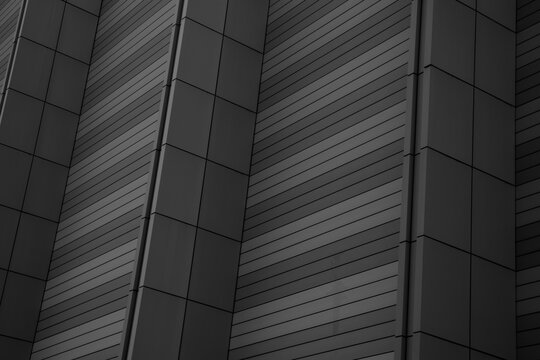 low angle view of modern building exterior with repeating panels