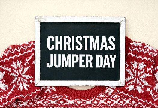 Festive christmas jumper day sign with cozy holiday sweater pattern in cheerful celebration theme