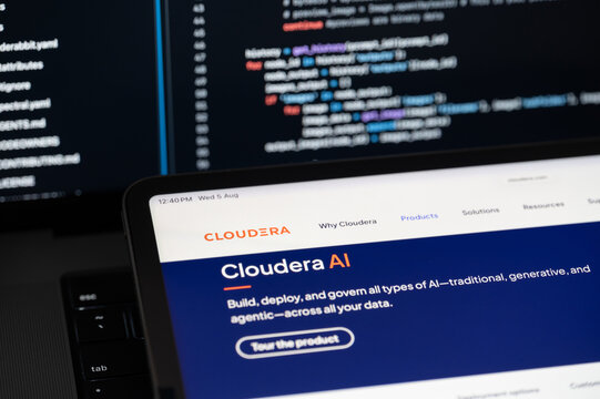 Cloudera Ai company web page on program code background