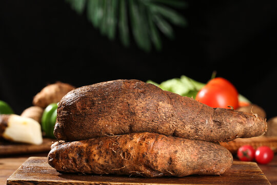 Fresh Raw Yams and Vegetables on Wooden Cutting Board - Healthy Organic Root Vegetables