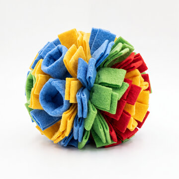 Generic soft fleece dog snuffle ball foraging toy isolated on white.