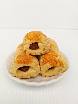Cookies concept in selective focus. Traditional cookies for Eid festive called pineapple tart or tat nenas or known as nastar in Indonesia bite-size pastries filled or topped with pineapple jam.

