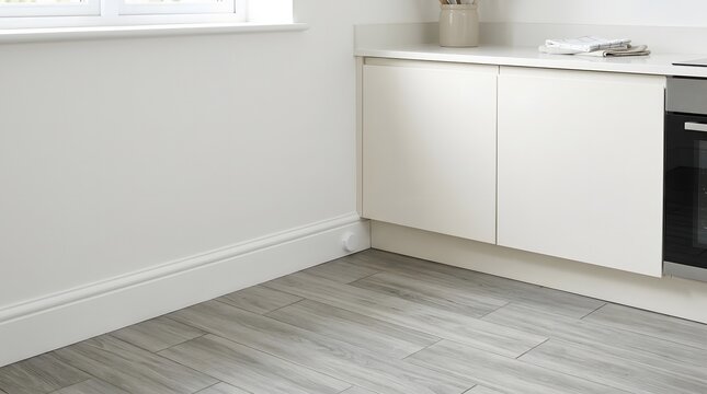 Minimal kitchen baseboard with discreet indoor bait station unit