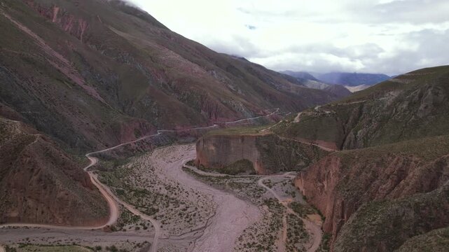 4K drone aerial view of Abra del C&oacute;ndor on the road to Iruya, Salta, Argentina. Spectacular Andean mountain pass with dramatic valleys, winding routes and breathtaking high altitude landscapes.